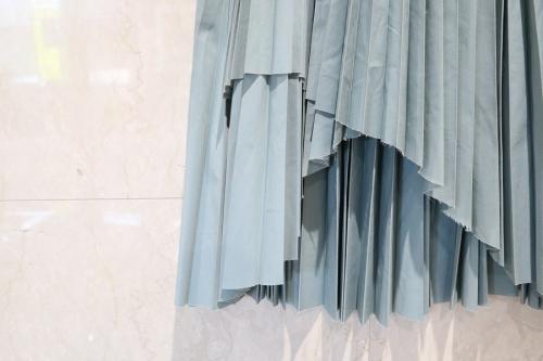 ラッププリーツスカートのWRAP PLEATS SKIRT