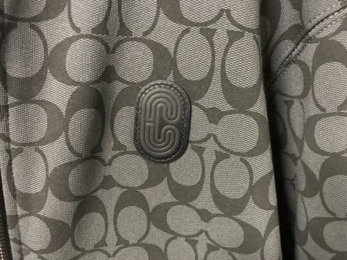 コーチのシグネチャープリントジップパーカー