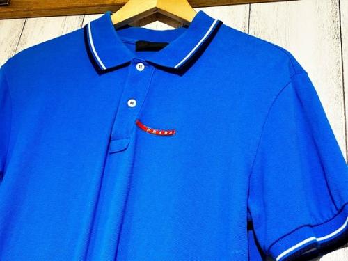 トップスのPolo shirt