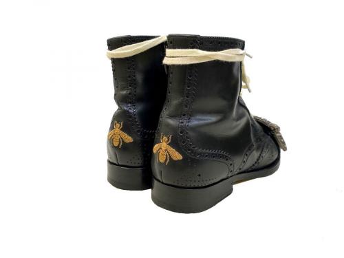 グッチのレースアップブローグブーツ